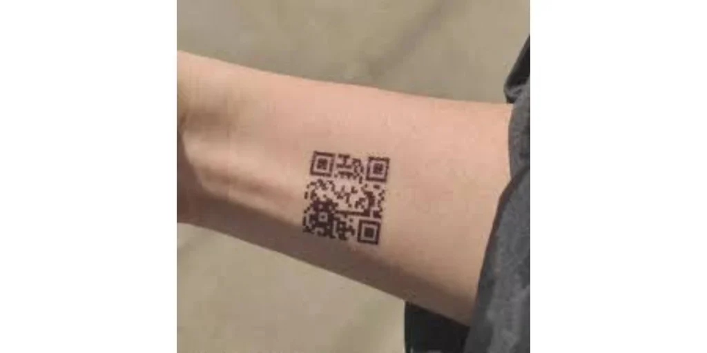 A QR Code tattoo on a wrist.