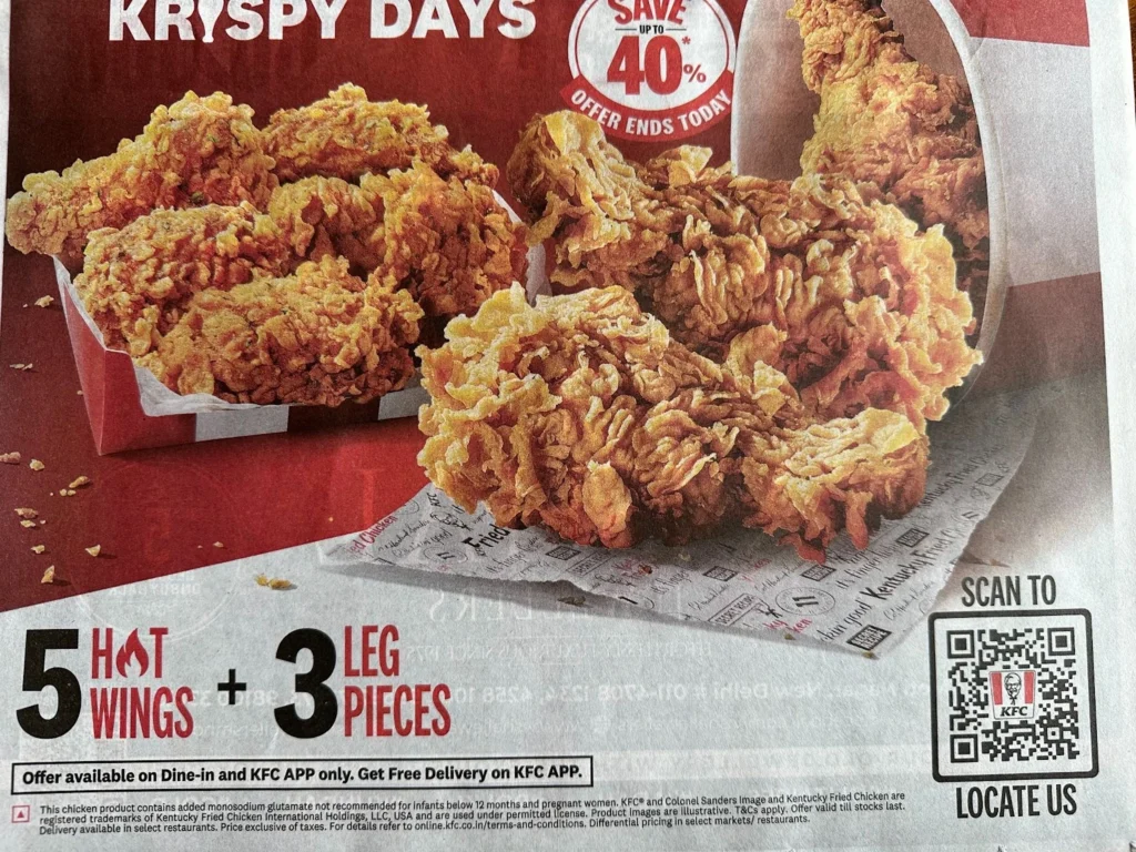 A snapshot of KFC QR Code promotion ad campaign from the newspaper. KFC promoting their exciting offer through print media campaign. 