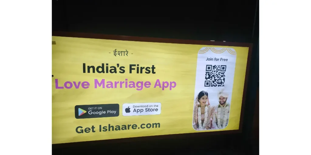 A digital out-of-home advertisement for Ishaare, a love marriage app, featuring a QR code linking to the App Store.