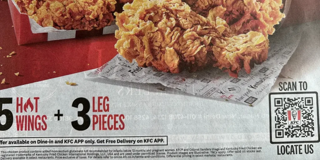 KFC newspaper ad with a QR code for Google Maps to locate their store.