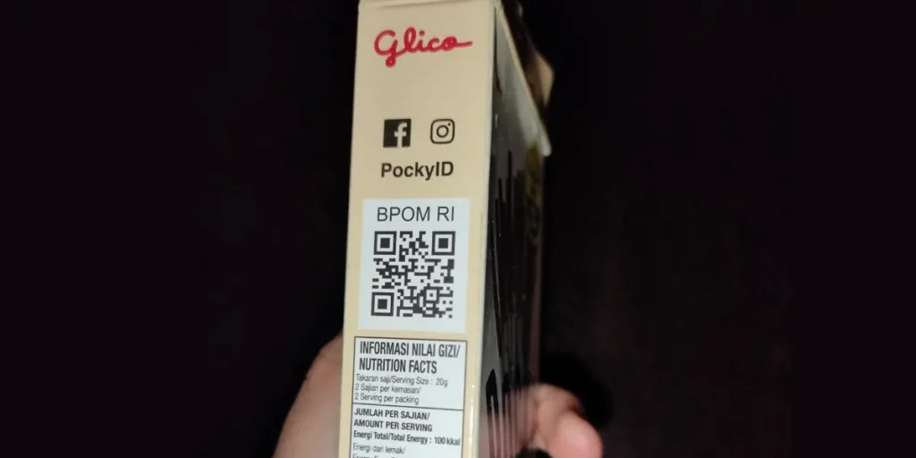 Pocky featuring a social media QR code on their product packaging for Facebook and Instagram.