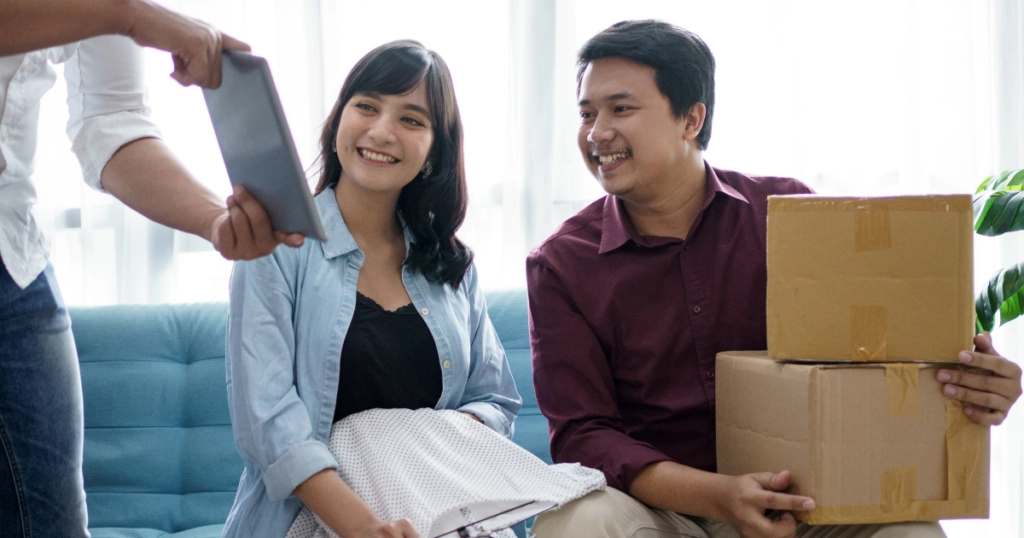 a couple looking at a QR Code in an email signature