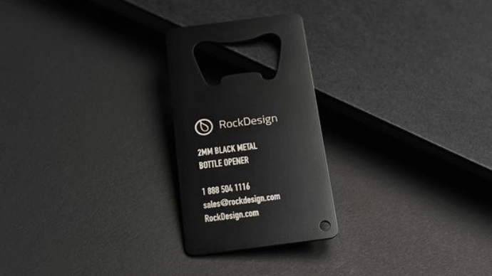 A black bottle opener shaped business card 