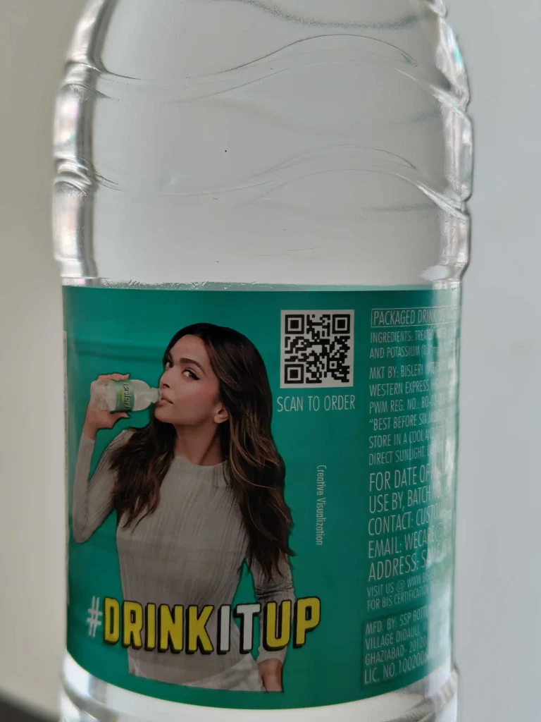 A micro-sized QR Code of 2-3 cm in size with a CTA on a water bottle nudging users to order bottles online.