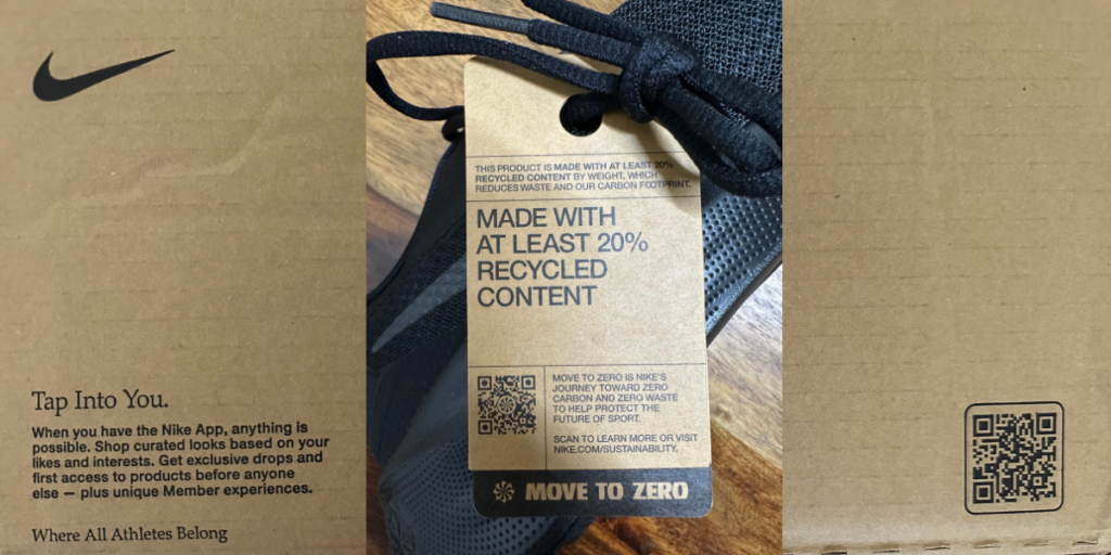 A box with a blue nike shoe inside of it and a tag with a text "Made with atleast 20% recycled content" and a QR Code on it