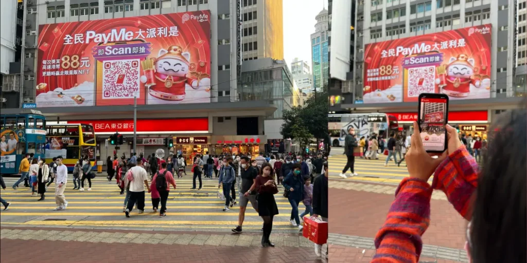 Person scanning PayMe's New Year's QR code campaign from a billboard in Causeway Bay.