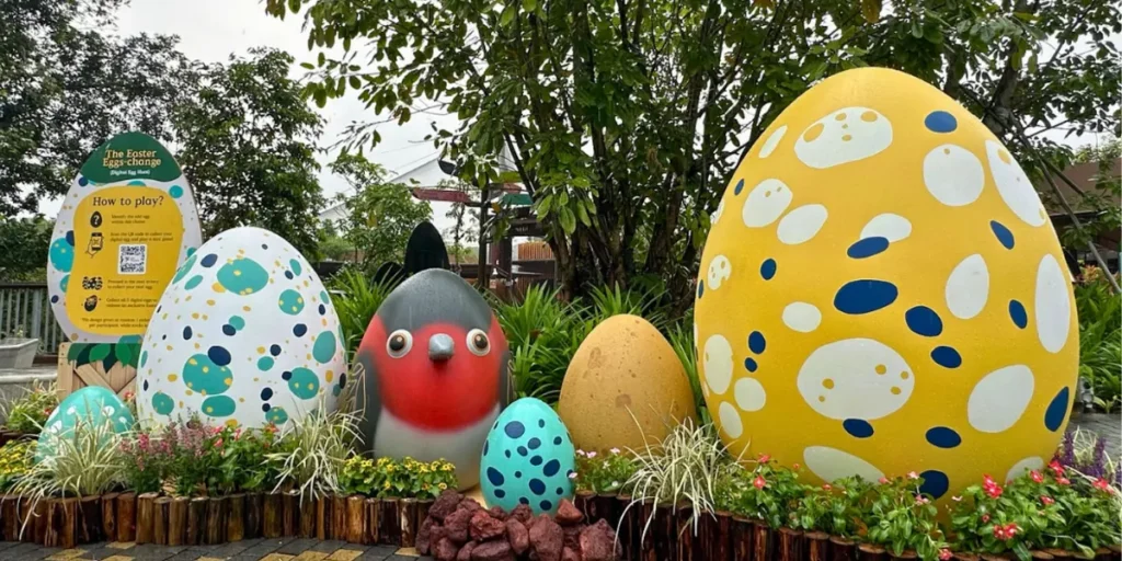 An image of Bird Paradise and Mandai Wildlife park representing Easter eggs and a board with a QR Code on it describing instructions