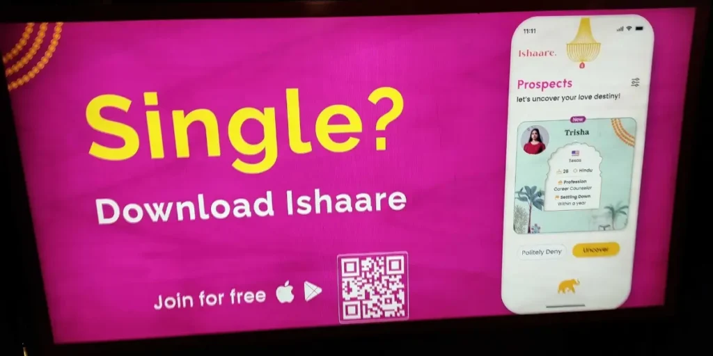 Ishaare company display screen ad with an OOH QR code to download their app.