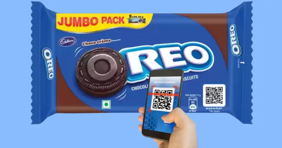 Person scanning a QR code on an Oreo packet with a smartphone.