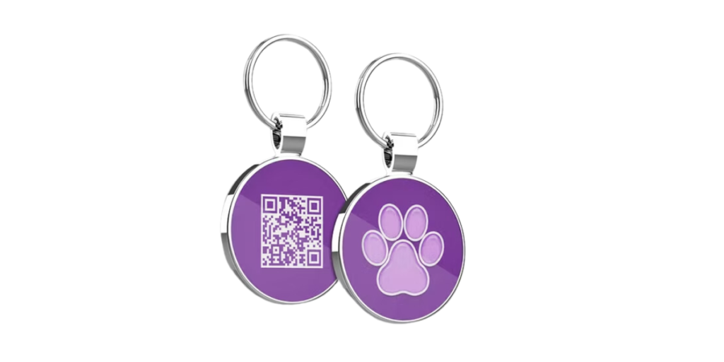 A purple coloured QR Code dog tag with a paw printed on the other side of it.