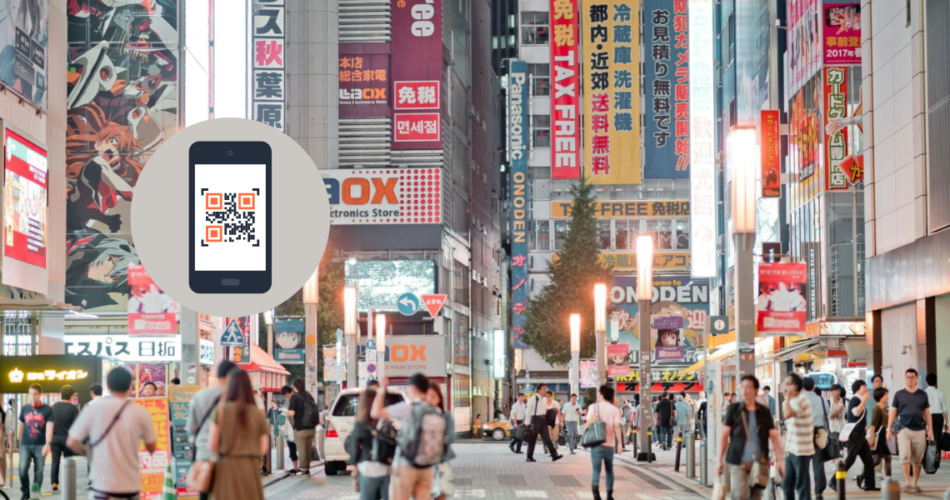 A busy street showing QR Codes in Japan