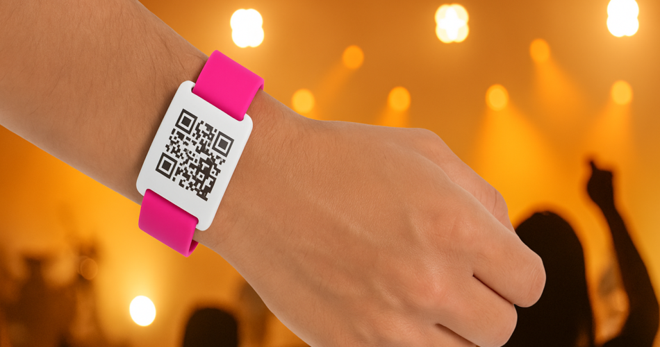 A man wearing a QR Code bracelet in event setting.