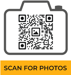 Example of an eye-catching camera-shaped QR code with ‘SCAN FOR PHOTOS’ text, generated with Scanova.