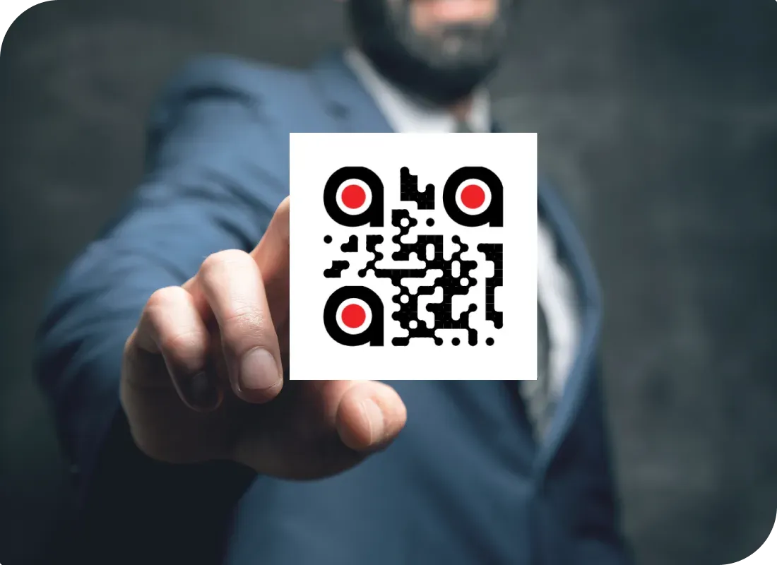 Person holding custom branded QR Code made with Scanova's white-labeling and custom QR Code eye-design
